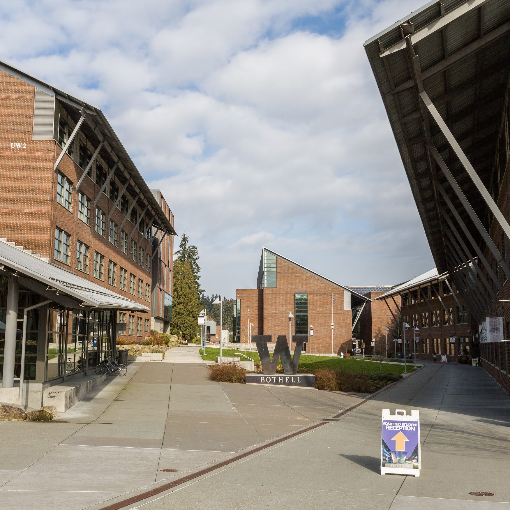 Family standing outside updated Bothell home after cost-effective exterior renovation project completion