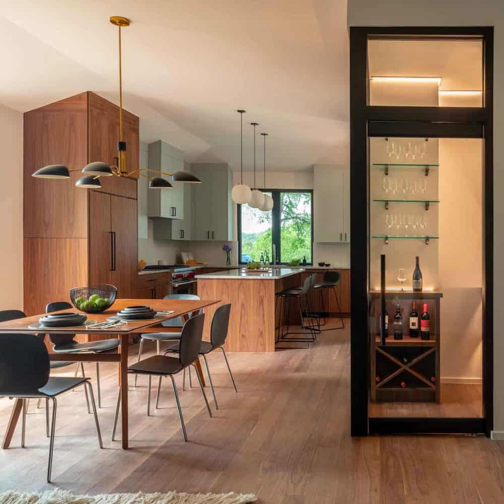 Family enjoying newly remodeled open-concept kitchen with custom cabinetry and bright natural lighting