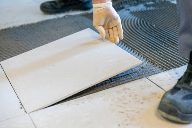 Tile Contractor measuring backsplash spacing in a Sammamish, WA kitchen before installation