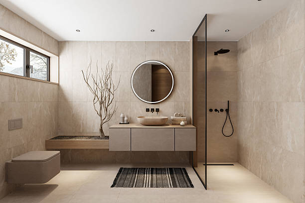 Contractor planning a Shower Remodel beside a Bellevue, WA bathroom with tile samples and fixture measurements